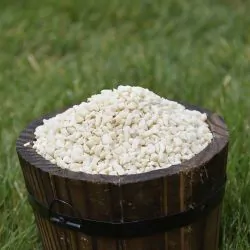 Small wooden bucket filled with Peanut Granules for Birds