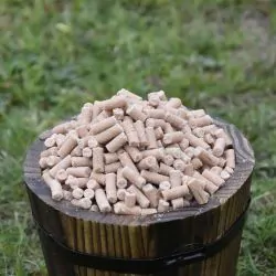 Small wooden bucket filled with Peanut Suet Pellets for Wild Birds