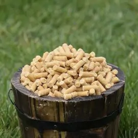 Small wooden bucket filled with Ready Peck Suet Pellets Insect & Mealworm for birds