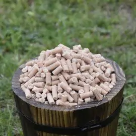 Small wooden bucket filled with Peanut Suet Pellets for Wild Birds