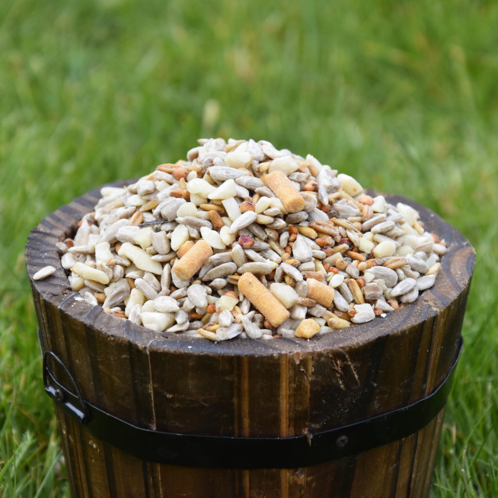 wooden bucket filled with Ivel Valley's Ready Peck Seed Feeder Mix garden gifts for mum